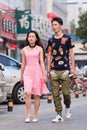 Young lovers walk on the street, Beijing, China